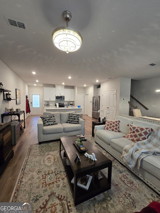 living room with wood-type flooring