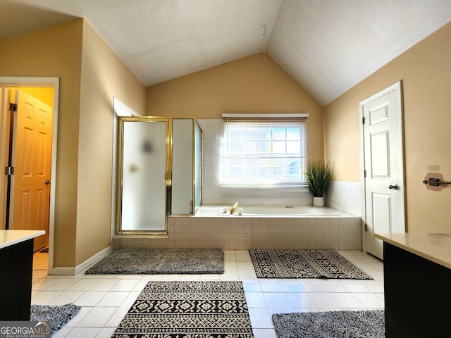 bathroom with tile patterned flooring, vanity, lofted ceiling, and plus walk in shower