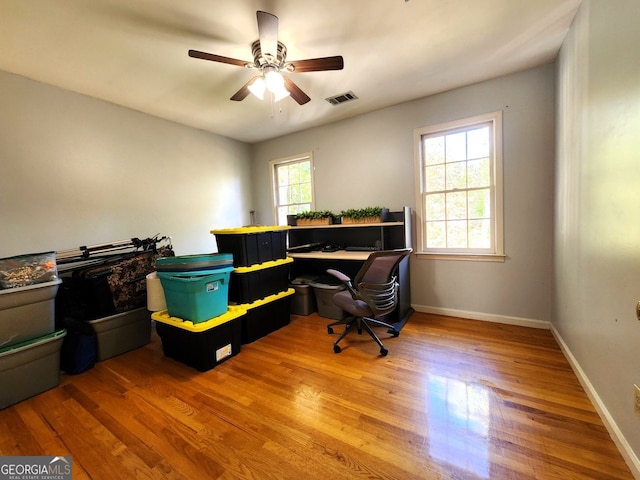 office space featuring hardwood / wood-style floors and ceiling fan