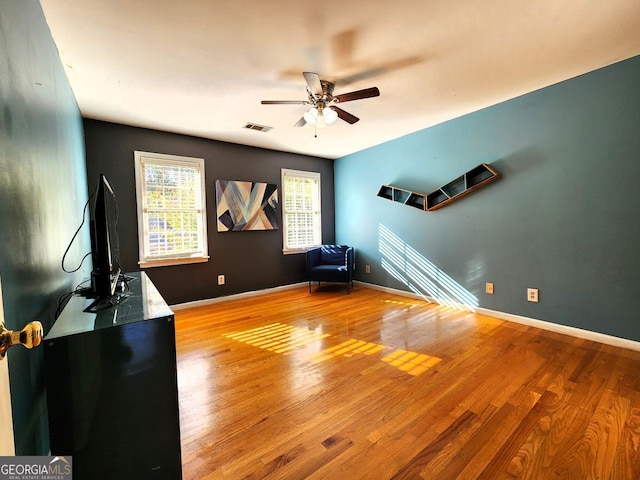 interior space with ceiling fan and light wood-type flooring