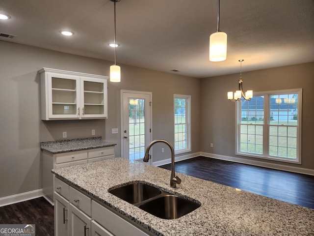 kitchen with white cabinetry, a healthy amount of sunlight, and sink