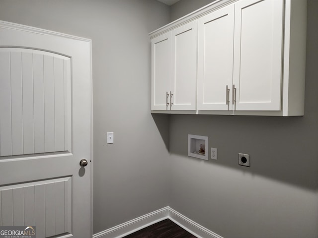 washroom with cabinets, hookup for a washing machine, dark hardwood / wood-style flooring, and electric dryer hookup