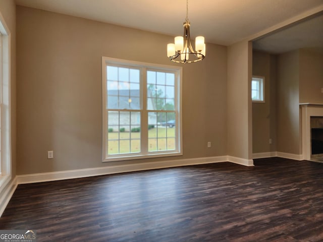 interior space with dark hardwood / wood-style flooring and a chandelier