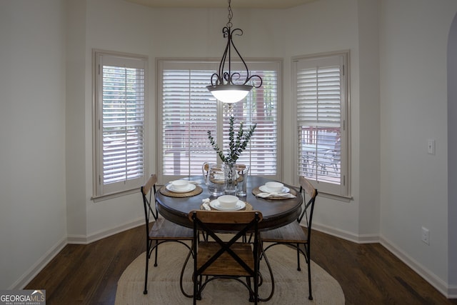 dining area featuring dark hardwood / wood-style flooring