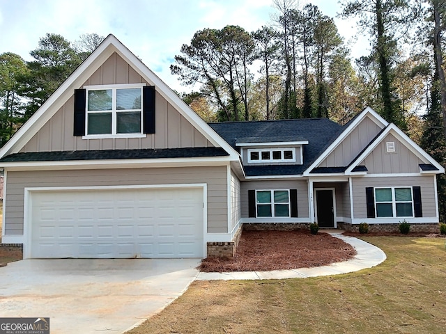 craftsman-style home with a front yard and a garage