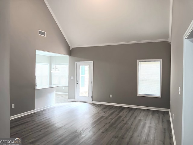 empty room with ornamental molding, a chandelier, high vaulted ceiling, and dark hardwood / wood-style flooring