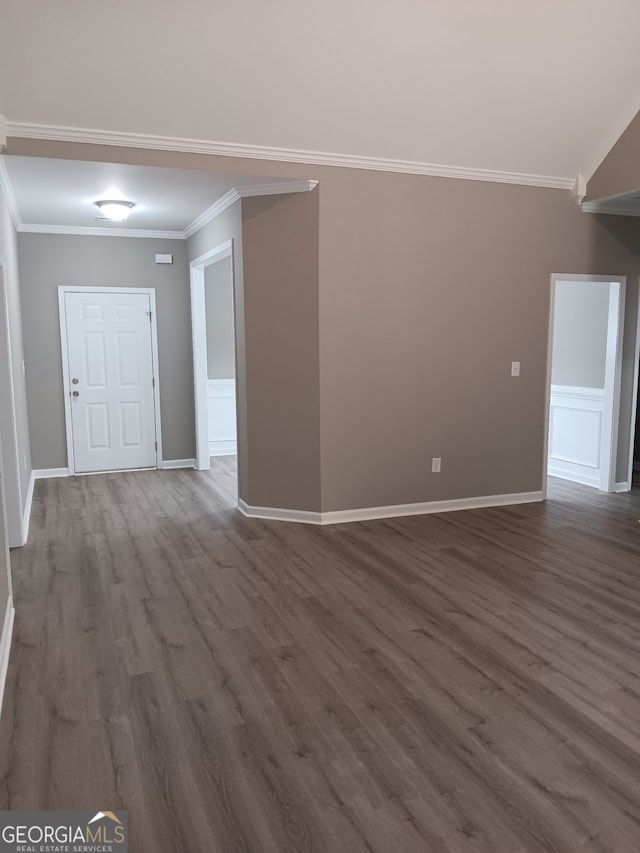 interior space featuring ornamental molding and dark hardwood / wood-style floors