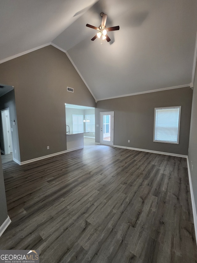 unfurnished living room with lofted ceiling, dark wood-type flooring, and ceiling fan