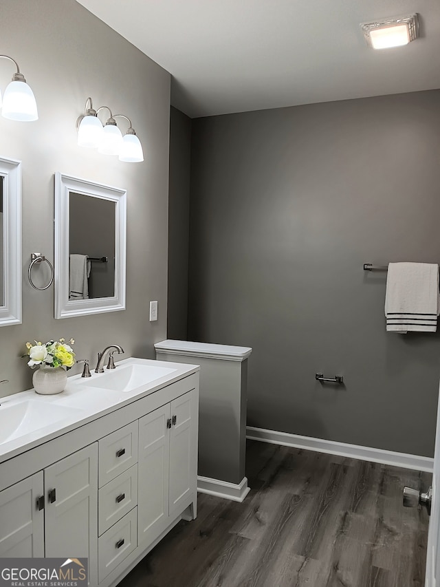 bathroom with vanity and hardwood / wood-style flooring