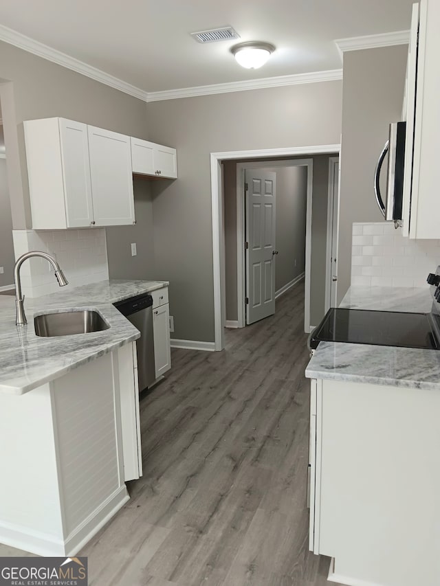 kitchen featuring light stone countertops, sink, white cabinetry, and stainless steel appliances