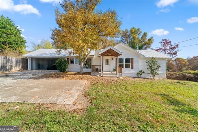 ranch-style home with covered porch and a front lawn