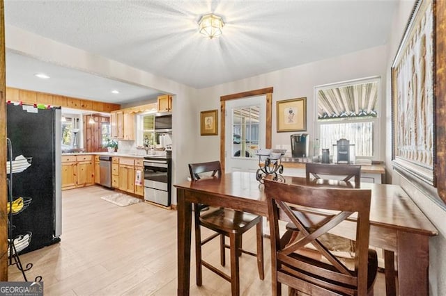 dining room featuring light wood-type flooring