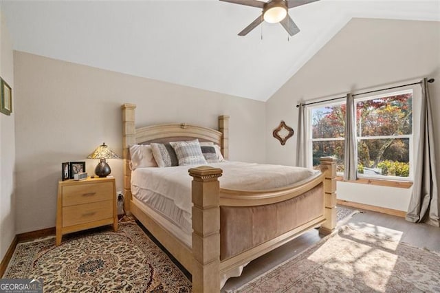 bedroom featuring ceiling fan, hardwood / wood-style flooring, and lofted ceiling