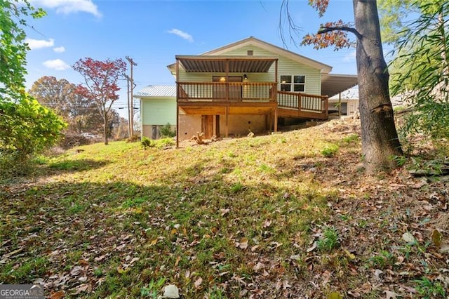 back of property featuring a wooden deck