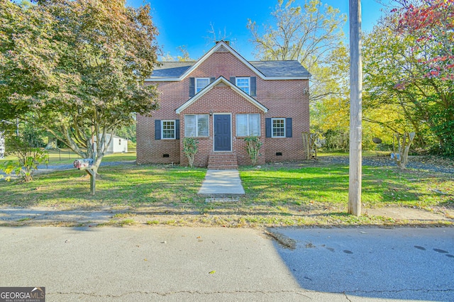 view of front of property with a front lawn