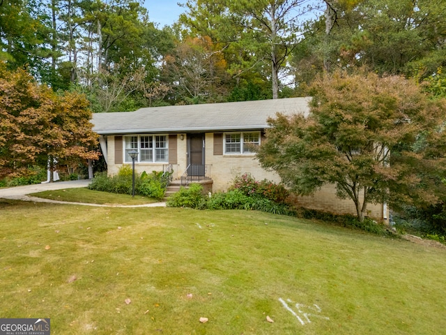 ranch-style house with a front yard