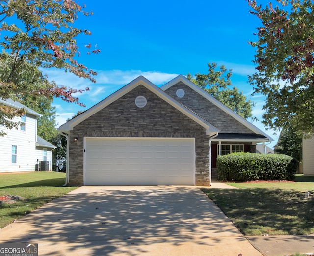 view of front of home with central AC, a garage, and a front lawn