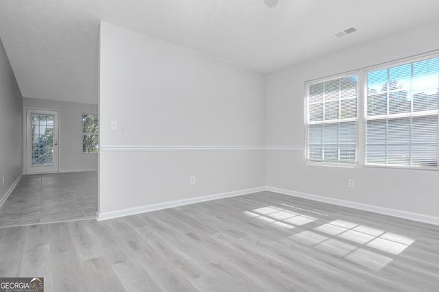 unfurnished room featuring light wood-type flooring