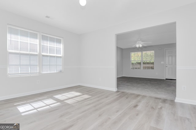 empty room featuring light hardwood / wood-style floors and ceiling fan