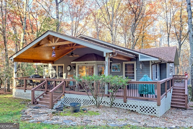 view of front of home featuring ceiling fan and a wooden deck