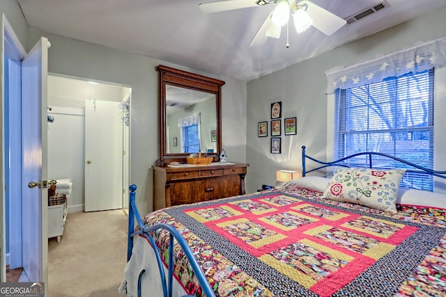 bedroom with light colored carpet and ceiling fan