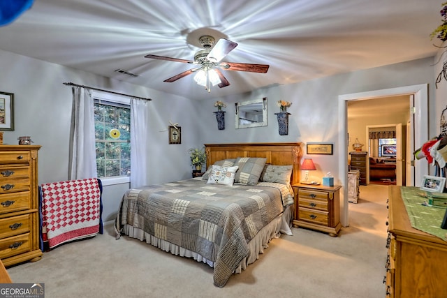 carpeted bedroom featuring ceiling fan