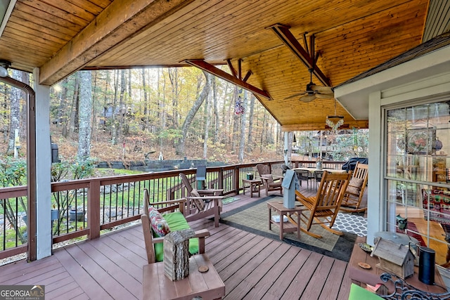 wooden terrace featuring ceiling fan