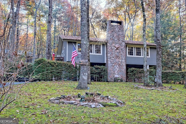 view of front of home with a front yard