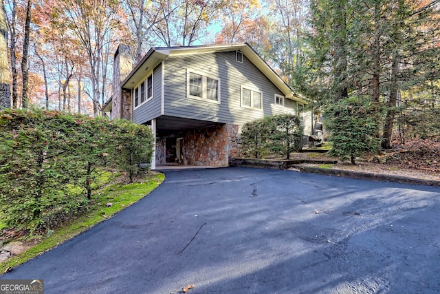 view of property exterior featuring a carport