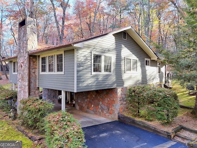 view of home's exterior featuring a carport