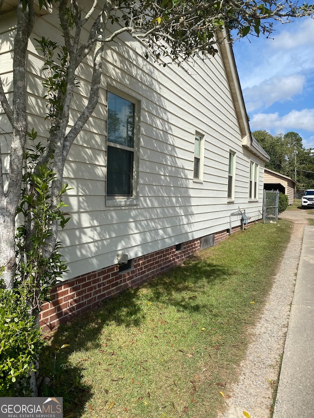 view of property exterior featuring a yard