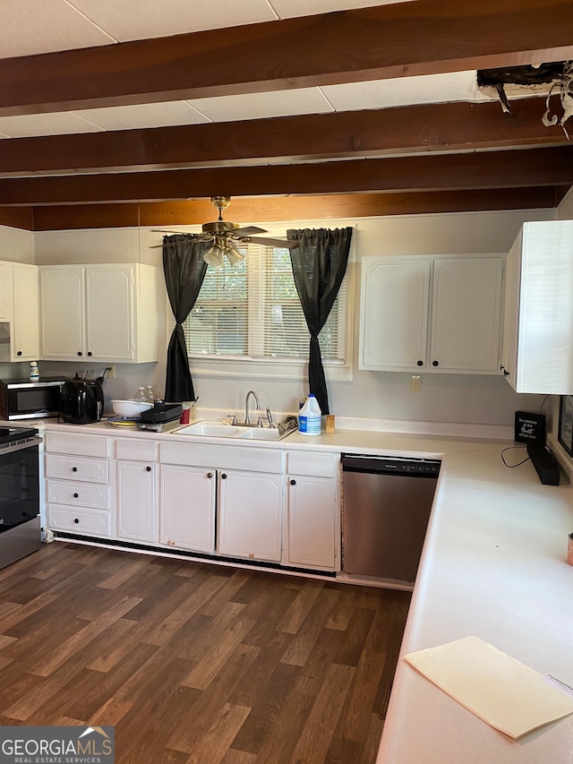 kitchen with beam ceiling, dark wood-type flooring, appliances with stainless steel finishes, and white cabinetry