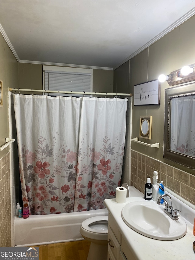 full bathroom with vanity, crown molding, tile walls, and shower / bath combo