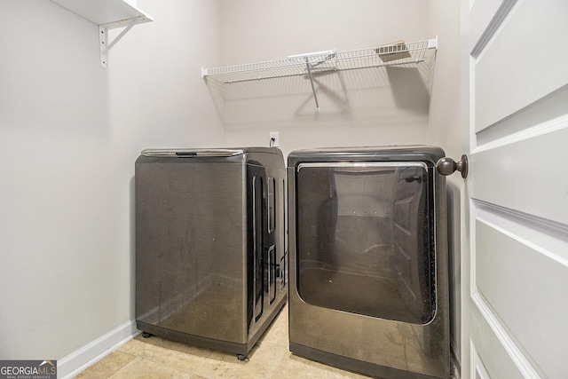 laundry room featuring separate washer and dryer