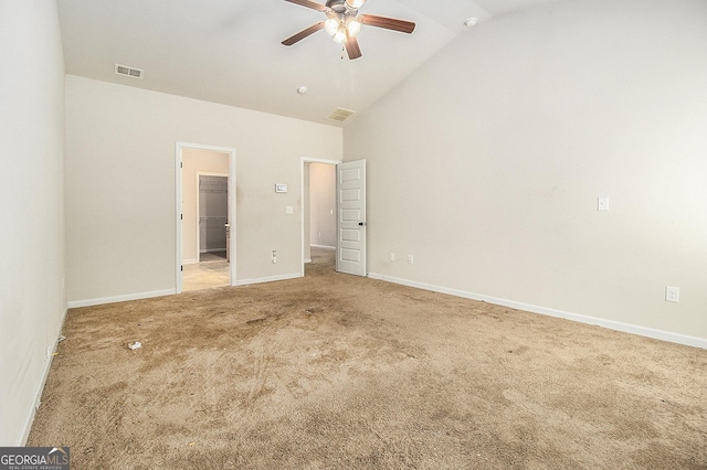 unfurnished bedroom with ceiling fan, lofted ceiling, and carpet floors