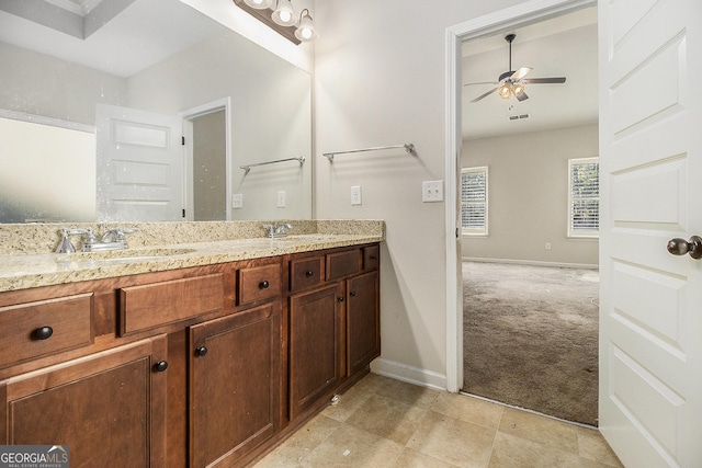 bathroom featuring ceiling fan and vanity