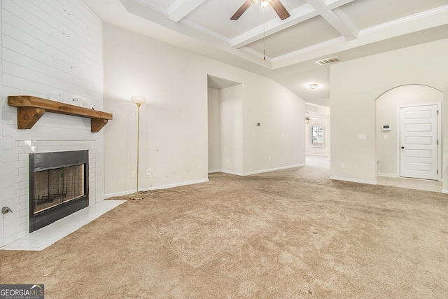 unfurnished living room featuring ceiling fan, beam ceiling, light colored carpet, and coffered ceiling