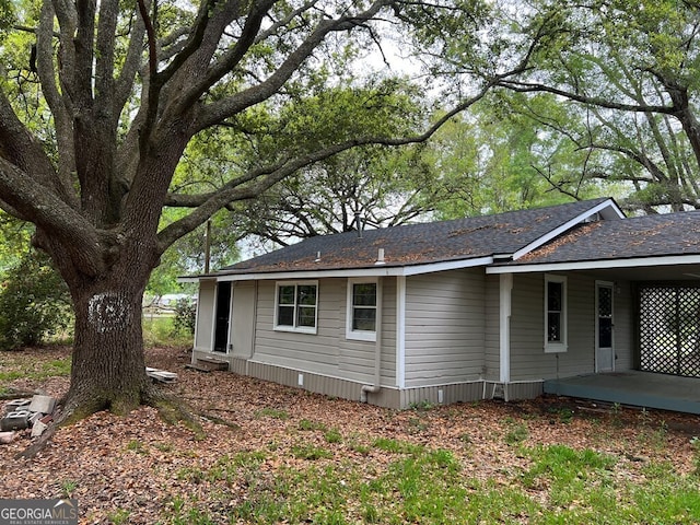 view of side of property with a patio