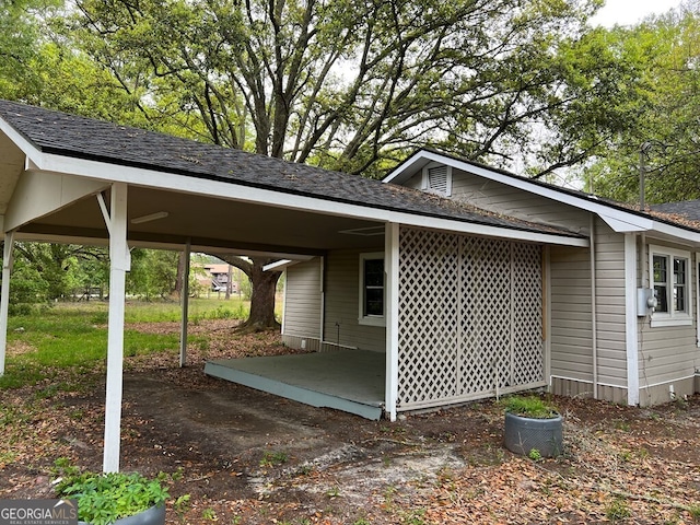 view of property exterior with a carport