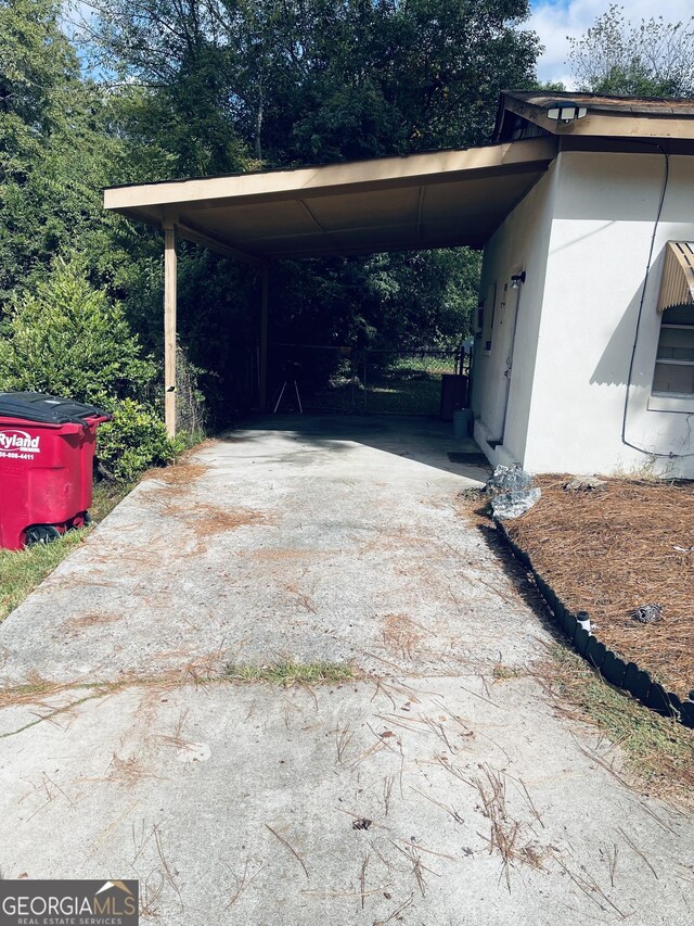 view of parking featuring a carport