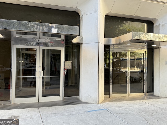 view of exterior entry featuring french doors