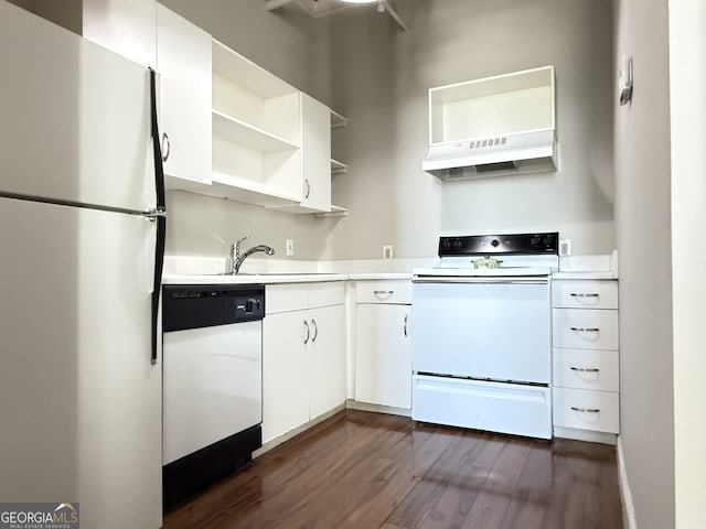 kitchen with dark wood-type flooring, sink, ventilation hood, white cabinetry, and white appliances