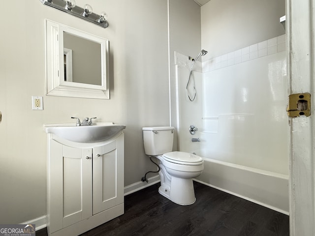 full bathroom featuring vanity, shower / washtub combination, hardwood / wood-style floors, and toilet