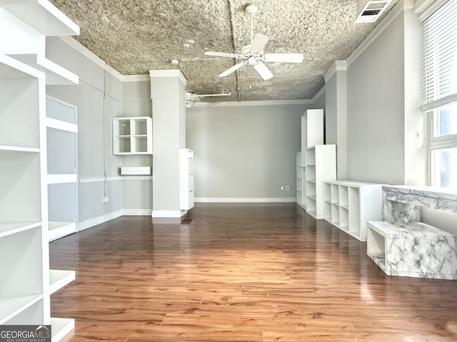 unfurnished living room featuring crown molding, hardwood / wood-style floors, and ceiling fan