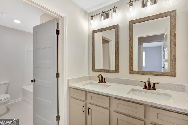 full bathroom featuring tile patterned floors, plus walk in shower, vanity, and toilet