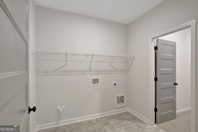 clothes washing area featuring gas dryer hookup, hookup for a washing machine, and hookup for an electric dryer