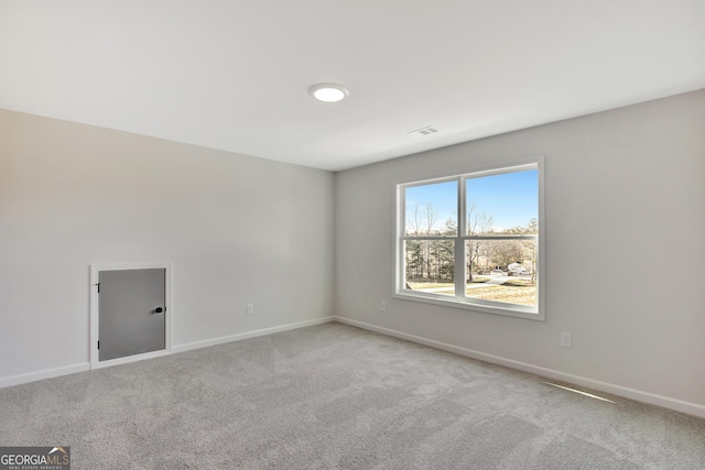 spare room featuring carpet floors