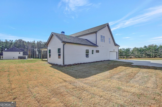 view of home's exterior featuring a garage and a lawn