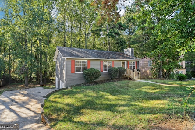 ranch-style home with a front lawn