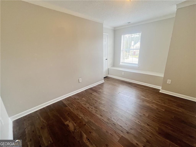 unfurnished room with dark hardwood / wood-style flooring, a textured ceiling, and crown molding